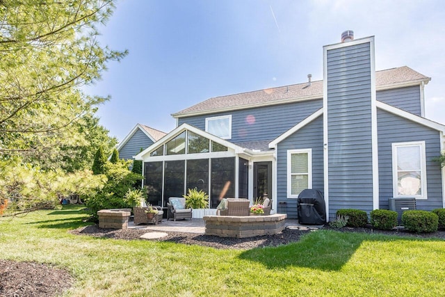 419 Wooten Ct S, Powell, OH 43065 - back of house with a sunroom, a chimney, a yard, and outdoor lounge area