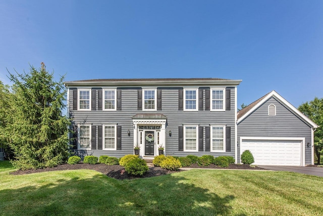 419 Wooten Ct S, Powell, OH 43065 - colonial-style house featuring asphalt driveway, a front yard, and a garage