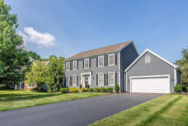 419 Wooten Ct S, Powell, OH 43065 - colonial-style house with asphalt driveway, an attached garage, and a front yard