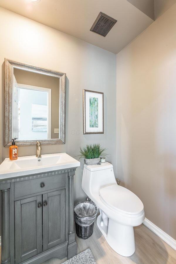 419 Wooten Ct S, Powell, OH 43065 - half bath with wood finished floors and vanity