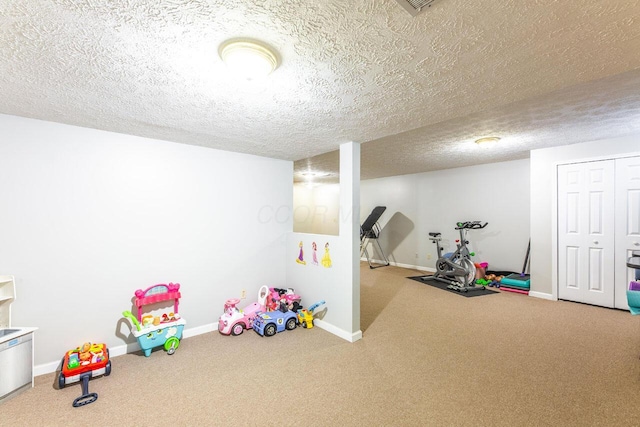 419 Wooten Ct S, Powell, OH 43065 - rec room featuring carpet flooring and a textured ceiling