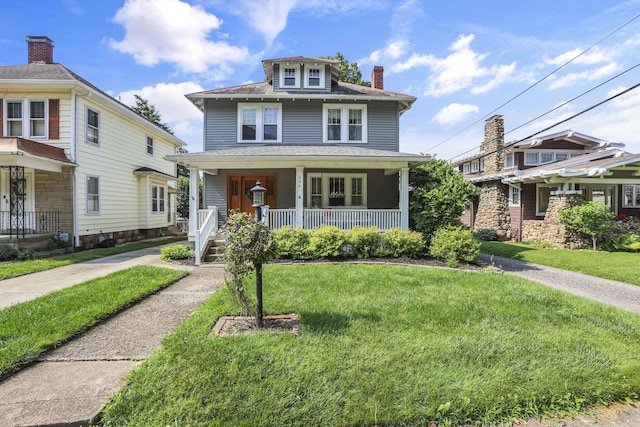 206 E Fair Ave, Lancaster, OH 43130 - traditional style home with a porch, a front yard, a chimney, and roof with shingles