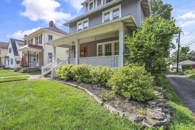 206 E Fair Ave, Lancaster, OH 43130 - traditional style home featuring a porch and a front yard