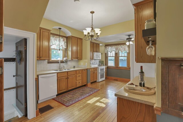 206 E Fair Ave, Lancaster, OH 43130 - kitchen with white appliances, light wood-style flooring, light countertops, and healthy amount of natural light