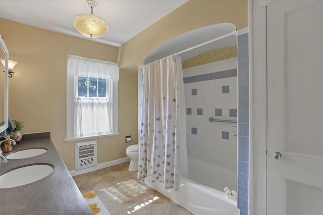 206 E Fair Ave, Lancaster, OH 43130 - full bathroom featuring heating unit, shower / bath combination with curtain, double vanity, and tile patterned flooring