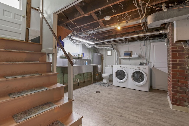 206 E Fair Ave, Lancaster, OH 43130 - laundry area featuring gas water heater, washer and clothes dryer, and wood finished floors