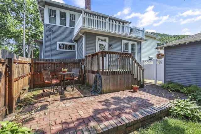 206 E Fair Ave, Lancaster, OH 43130 - back of house with a fenced backyard, a patio, a balcony, a chimney, and outdoor dining space