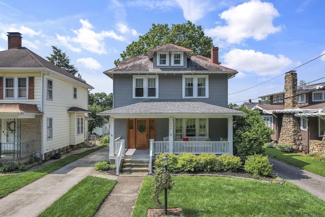 206 E Fair Ave, Lancaster, OH 43130 - american foursquare style home featuring covered porch, a chimney, a front lawn, and driveway