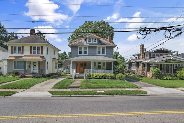 206 E Fair Ave, Lancaster, OH 43130 - american foursquare style home with a porch, a chimney, and a front yard