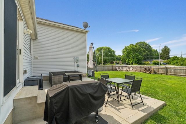2587 Weeping Willow Ct, Columbus, OH 43207 - fenced backyard with a grill, outdoor dining space, a patio area, and an outdoor hangout area