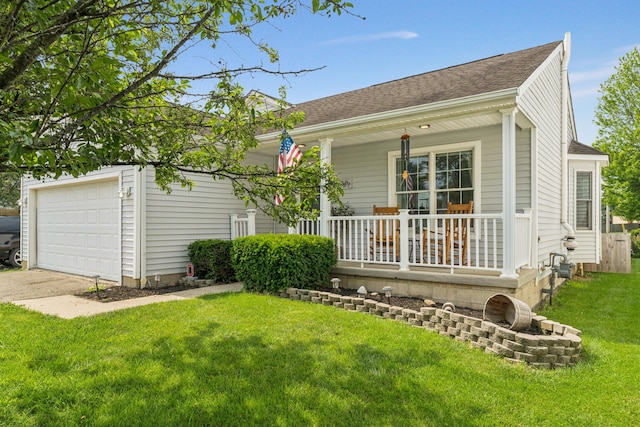 2587 Weeping Willow Ct, Columbus, OH 43207 - rear view of house with covered porch, a garage, a lawn, a shingled roof, and driveway