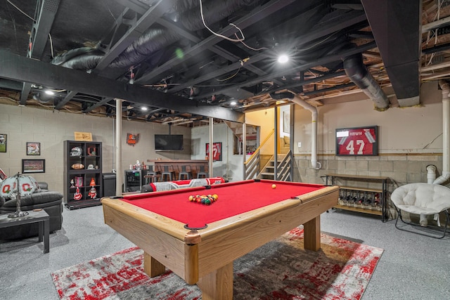2587 Weeping Willow Ct, Columbus, OH 43207 - playroom with concrete block wall, billiards, and speckle patterned floor