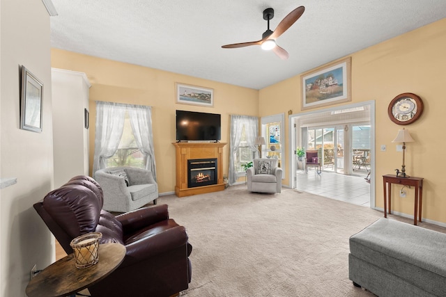 3625 Peany Ln, Canal Winchester, OH 43110 - living room with ceiling fan, carpet flooring, and a glass covered fireplace