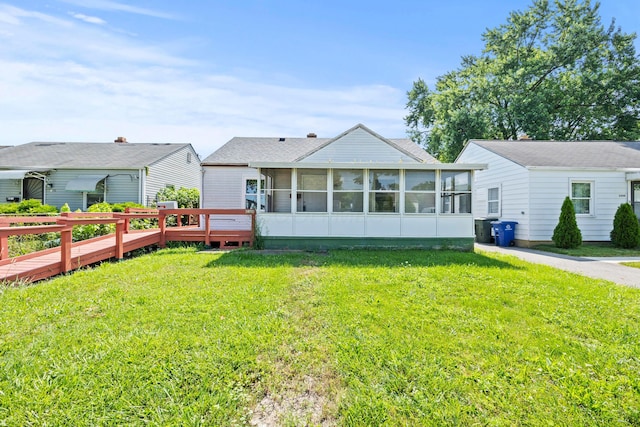 2300 Atwood Ter, Columbus, OH 43211 - back of house featuring a sunroom and a yard