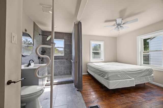 2300 Atwood Ter, Columbus, OH 43211 - bedroom with multiple windows and a ceiling fan
