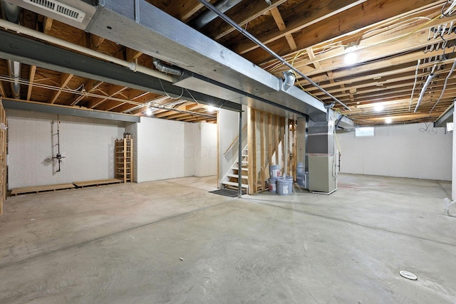 5497 Mirage Dr, Hilliard, OH 43026 - below grade area featuring heating unit and stairs
