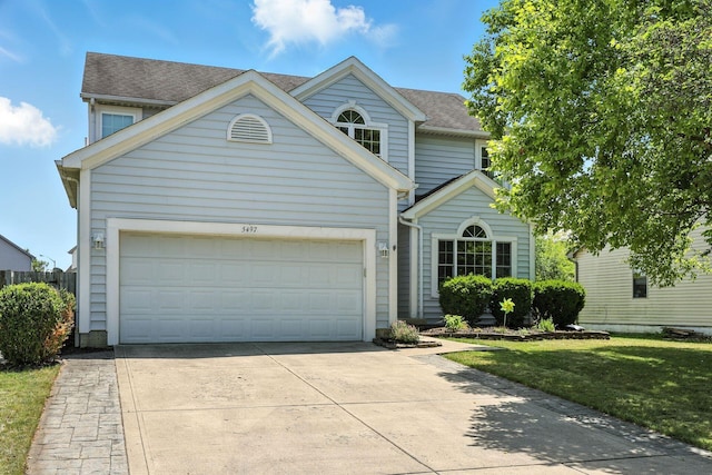 5497 Mirage Dr, Hilliard, OH 43026 - traditional-style house featuring concrete driveway, an attached garage, a shingled roof, and a front yard