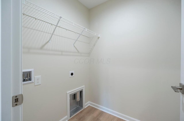 32 Maple St, Jeffersonville, OH 43128 - laundry area with electric dryer hookup, hookup for a washing machine, and wood finished floors