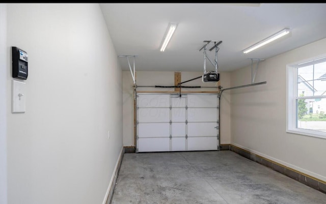 32 Maple St, Jeffersonville, OH 43128 - garage with a garage door opener and baseboards