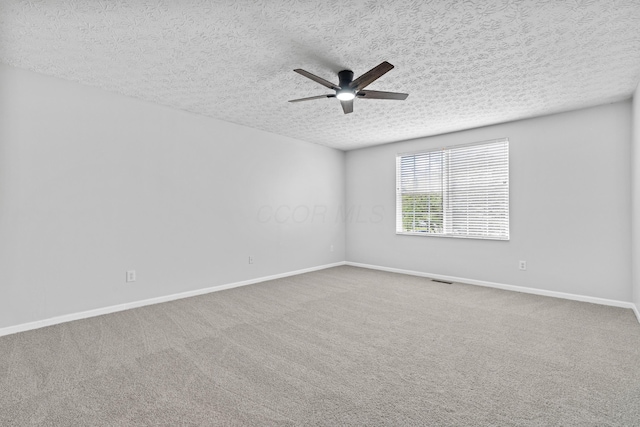 4690 Ascot Dr, Columbus, OH 43229 - spare room featuring ceiling fan, a textured ceiling, and carpet floors