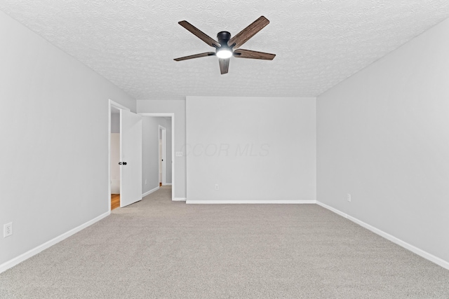 4690 Ascot Dr, Columbus, OH 43229 - spare room with a ceiling fan, a textured ceiling, and carpet
