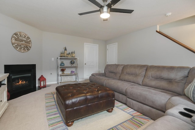 5649 Chippewa Falls St, Dublin, OH 43016 - carpeted living room with a ceiling fan and a fireplace with flush hearth