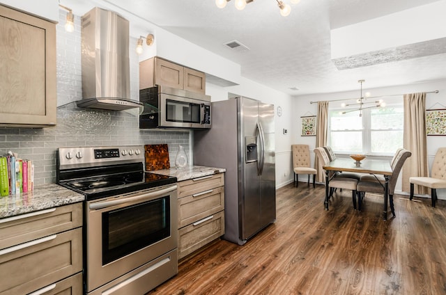 230 Barcelona Ave, Westerville, OH 43081 - kitchen featuring stainless steel appliances, wall chimney range hood, a chandelier, backsplash, and a textured ceiling