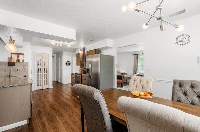 230 Barcelona Ave, Westerville, OH 43081 - dining area with a chandelier and dark wood-style floors