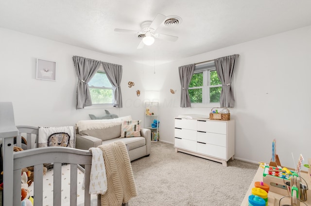 230 Barcelona Ave, Westerville, OH 43081 - bedroom with multiple windows, light colored carpet, a nursery area, and a ceiling fan