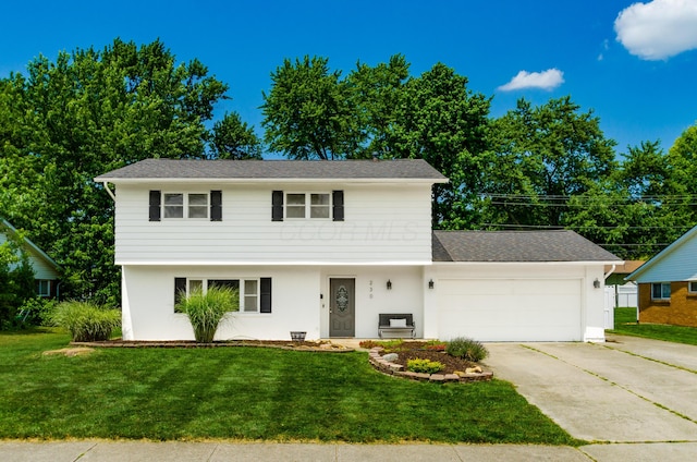 230 Barcelona Ave, Westerville, OH 43081 - colonial house with an attached garage, concrete driveway, a front yard, and stucco siding