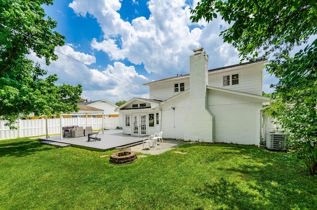 230 Barcelona Ave, Westerville, OH 43081 - back of house featuring french doors, a chimney, brick siding, a patio area, and an outdoor living space with a fire pit