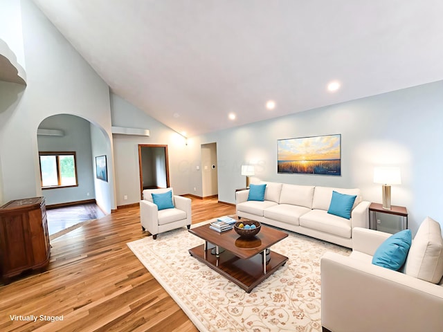 3100 Kropp Rd, Grove City, OH 43123 - living area with arched walkways, light wood-type flooring, high vaulted ceiling, and recessed lighting