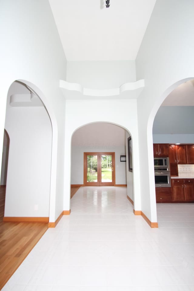 3100 Kropp Rd, Grove City, OH 43123 - hall featuring arched walkways, a towering ceiling, and light tile patterned floors