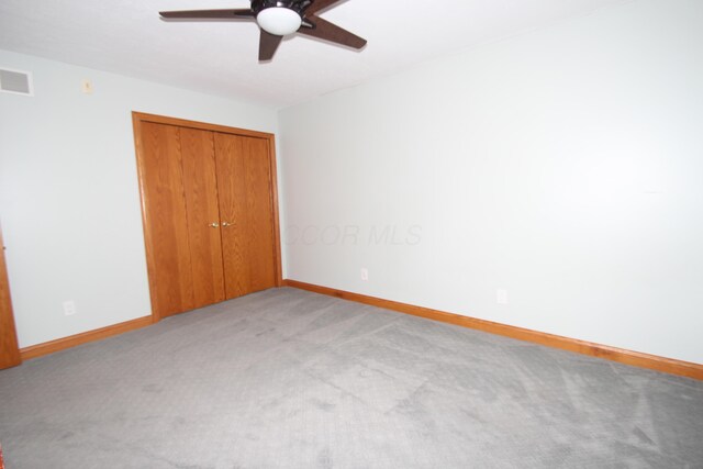 3100 Kropp Rd, Grove City, OH 43123 - unfurnished bedroom featuring light colored carpet, a closet, and a ceiling fan