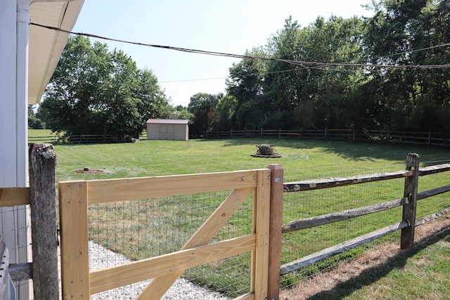 4224 Tschopp Rd NE, Lancaster, OH 43130 - fenced backyard featuring a storage unit and a view of rural / pastoral area