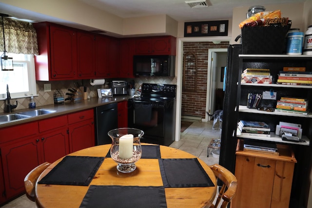 4224 Tschopp Rd NE, Lancaster, OH 43130 - kitchen with black appliances, backsplash, and baseboard heating