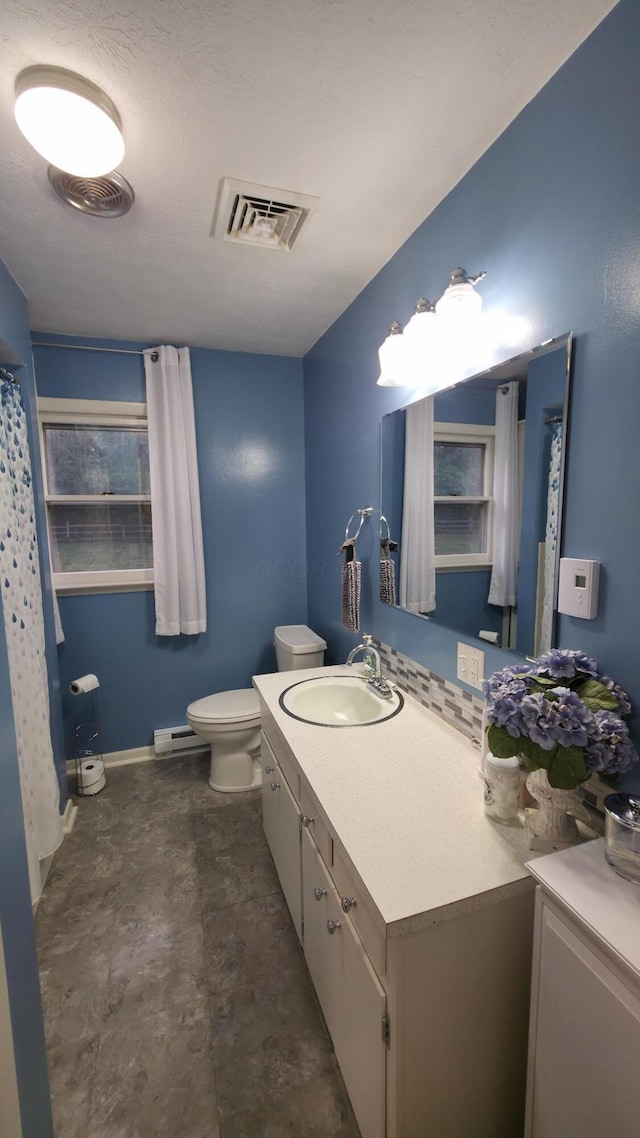 4224 Tschopp Rd NE, Lancaster, OH 43130 - bathroom featuring vanity, a baseboard heating unit, concrete flooring, and a shower with curtain