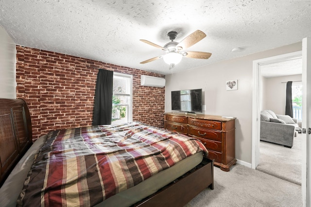 3053 E Old Duvall Ct, Lockbourne, OH 43137 - bedroom featuring an AC wall unit, brick wall, light carpet, a textured ceiling, and a ceiling fan
