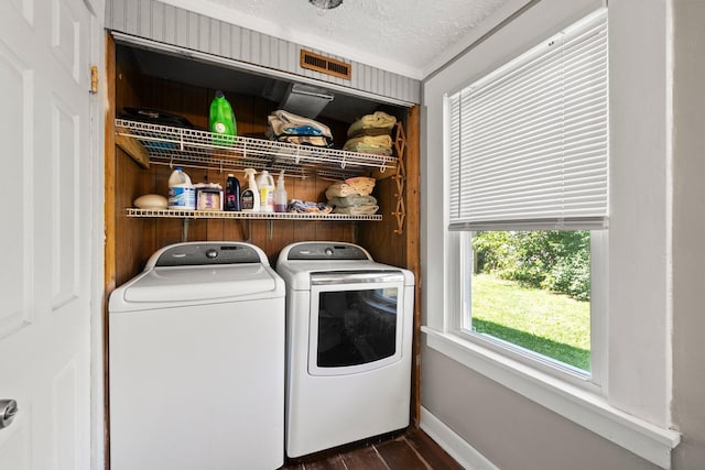 3053 E Old Duvall Ct, Lockbourne, OH 43137 - washroom with washer and clothes dryer, dark wood finished floors, a textured ceiling, and crown molding