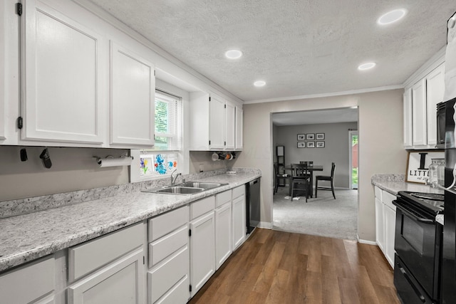 3053 E Old Duvall Ct, Lockbourne, OH 43137 - kitchen with black range with electric cooktop, white cabinetry, light countertops, a textured ceiling, and dishwasher