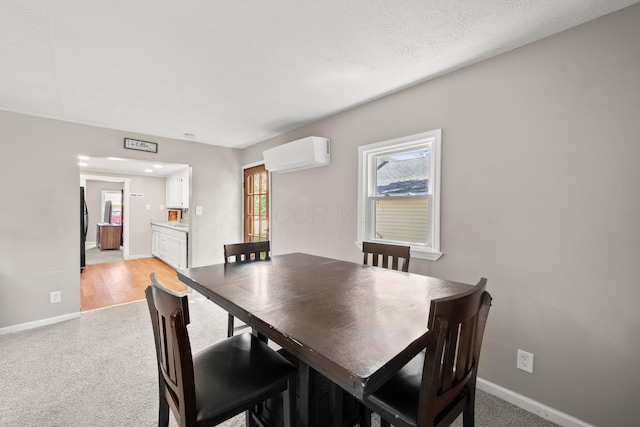 3053 E Old Duvall Ct, Lockbourne, OH 43137 - dining area featuring a wall unit AC and light colored carpet