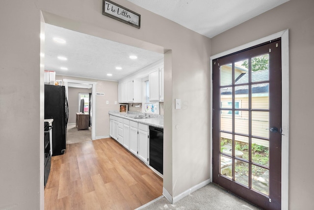 3053 E Old Duvall Ct, Lockbourne, OH 43137 - kitchen featuring black appliances, white cabinetry, recessed lighting, and light wood-style floors