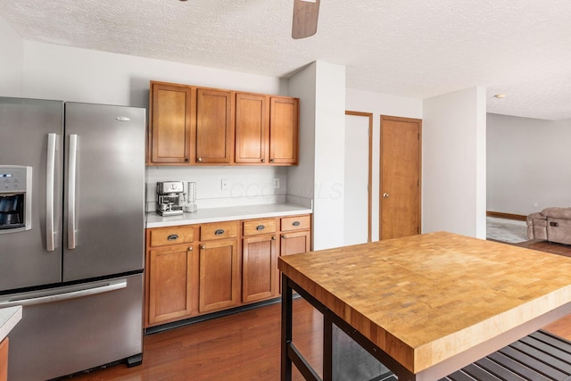 217 Knight Dream St, Delaware, OH 43015 - kitchen with stainless steel fridge with ice dispenser, dark wood-style flooring, brown cabinets, light countertops, and a textured ceiling
