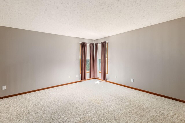 217 Knight Dream St, Delaware, OH 43015 - spare room with carpet flooring and a textured ceiling