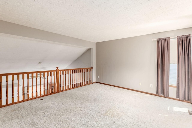 217 Knight Dream St, Delaware, OH 43015 - carpeted spare room featuring a textured ceiling and vaulted ceiling