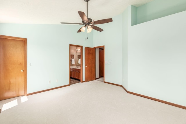 217 Knight Dream St, Delaware, OH 43015 - unfurnished bedroom with carpet floors, high vaulted ceiling, ensuite bathroom, and a ceiling fan