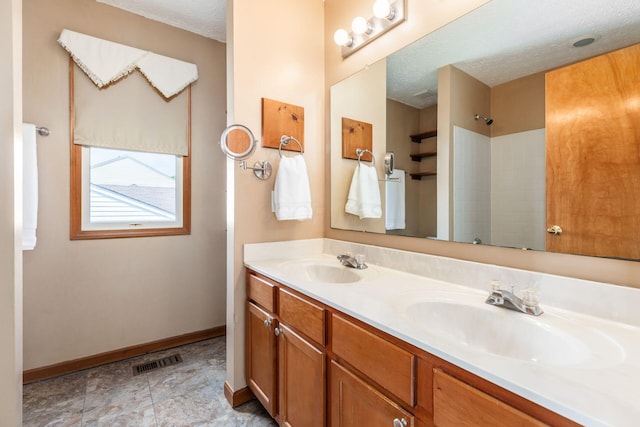 217 Knight Dream St, Delaware, OH 43015 - full bath featuring double vanity, a shower, and a textured ceiling