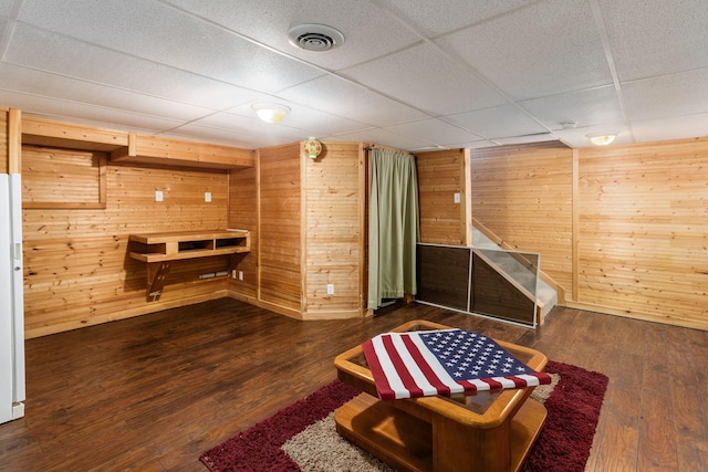 217 Knight Dream St, Delaware, OH 43015 - finished basement with a paneled ceiling, wooden walls, wood finished floors, and stairway