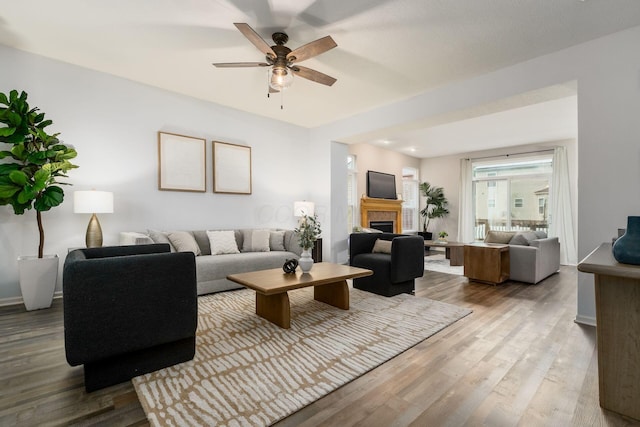 978 Vanwert Loop, Blacklick, OH 43004 - living room with a ceiling fan, a fireplace, and wood finished floors