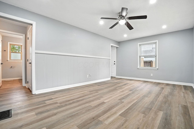 4120 Mcallister Ave, Columbus, OH 43227 - spare room featuring healthy amount of natural light, wood finished floors, a ceiling fan, a wainscoted wall, and recessed lighting